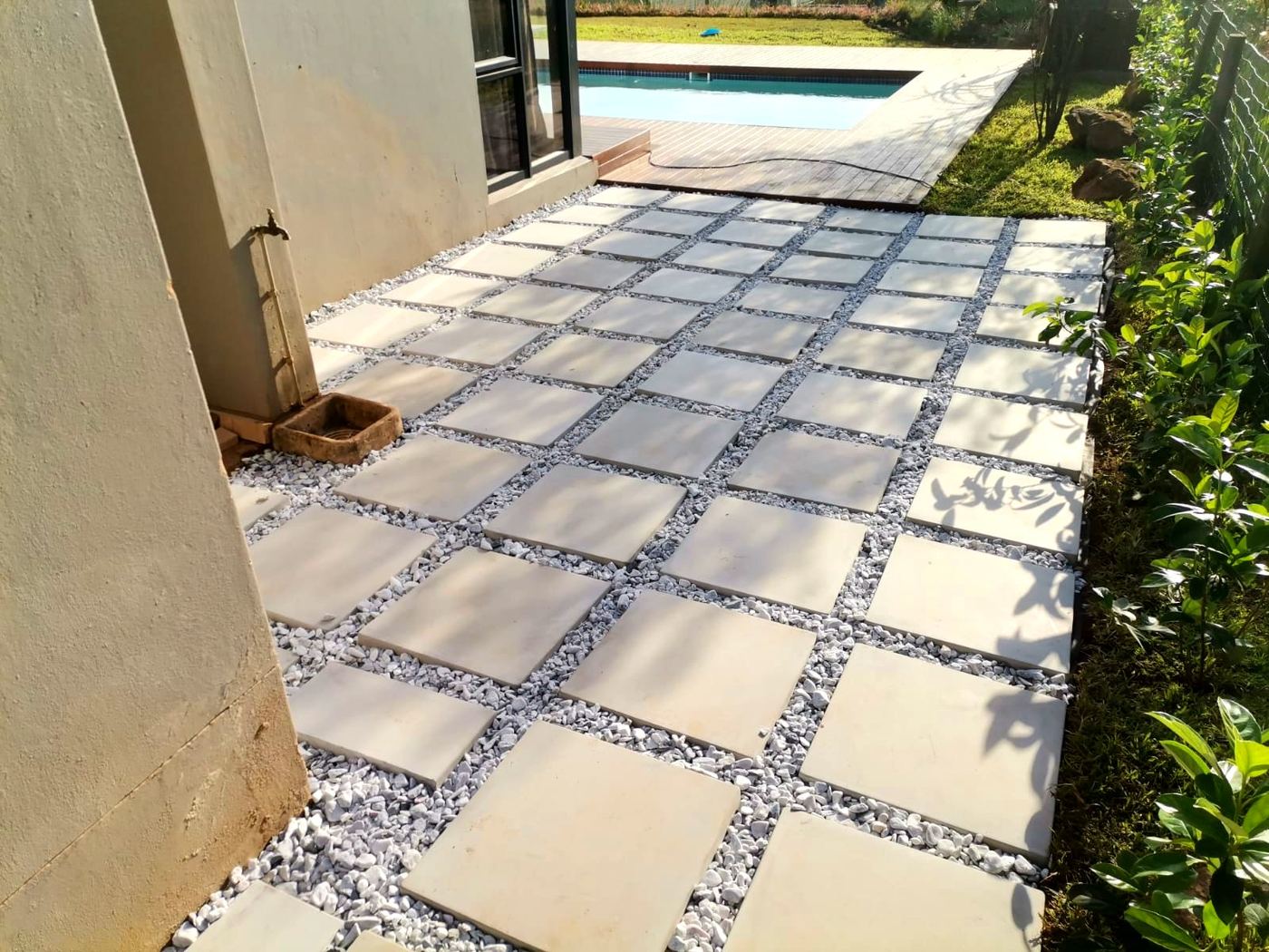 Paving with white gravel infill near pool area in Durban North