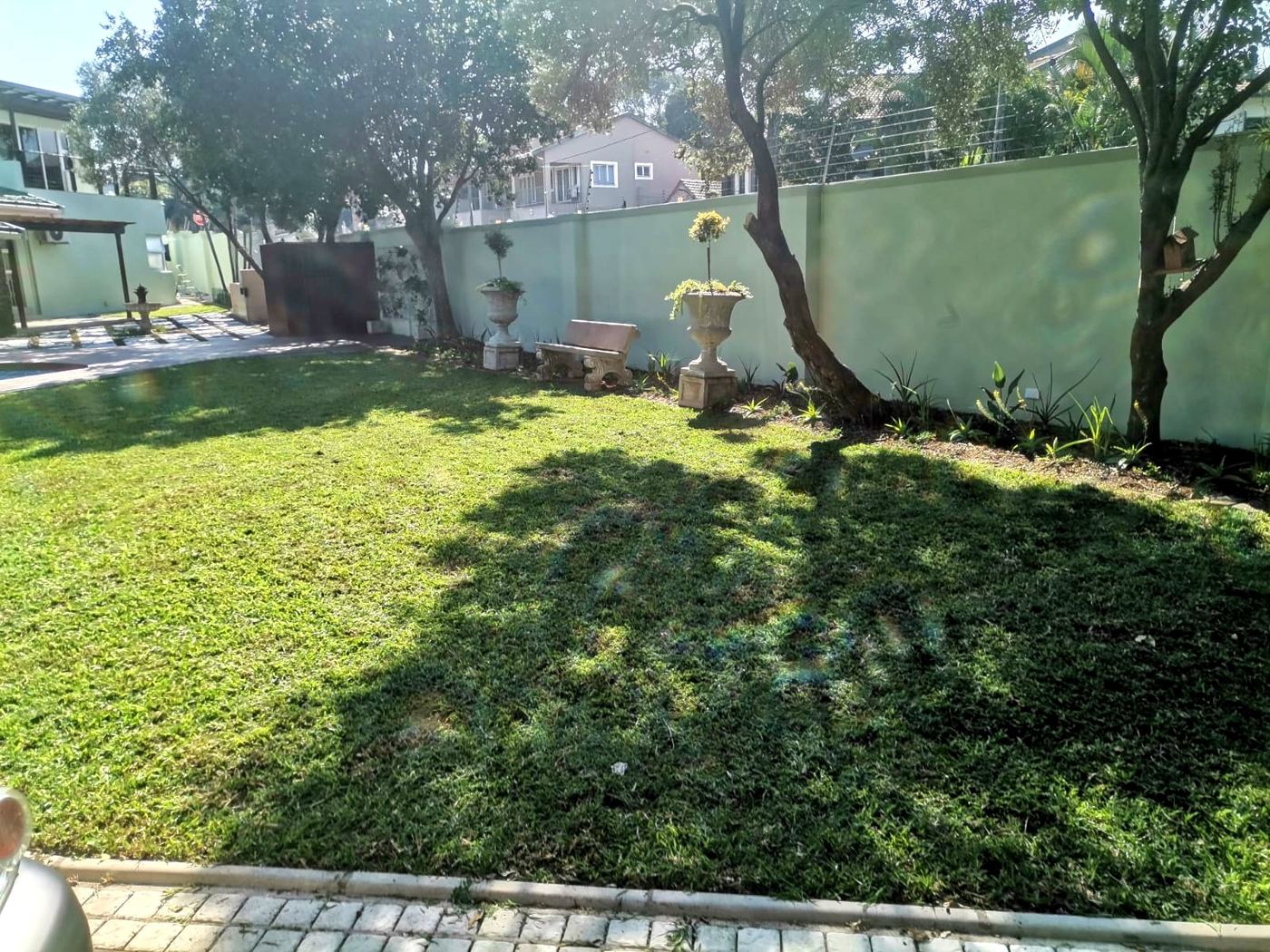 Well-kept lawn with mature trees in Durban North